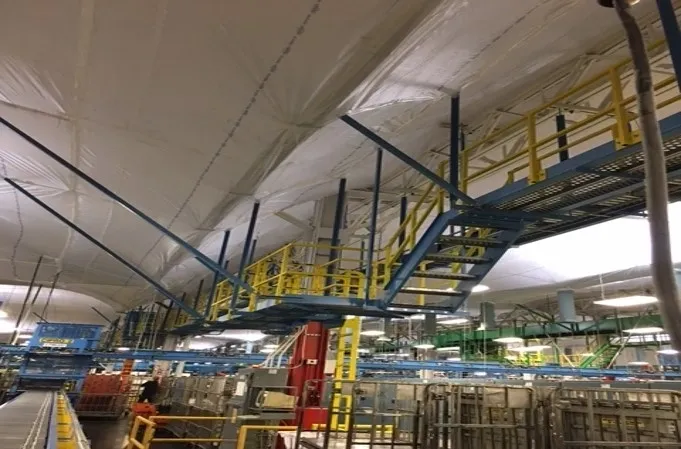 Elevated walkways near temporary suspended ceiling covers