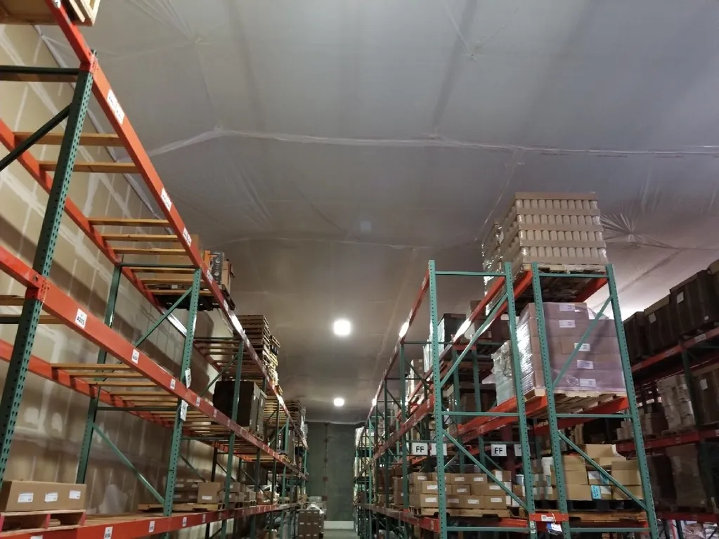 A warehouse covered by temporary suspended ceiling covers
