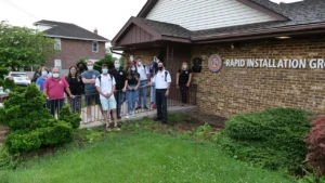 A group of people standing in front of a building.