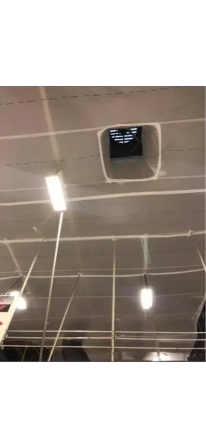 A temporary suspended ceiling cover with a vent