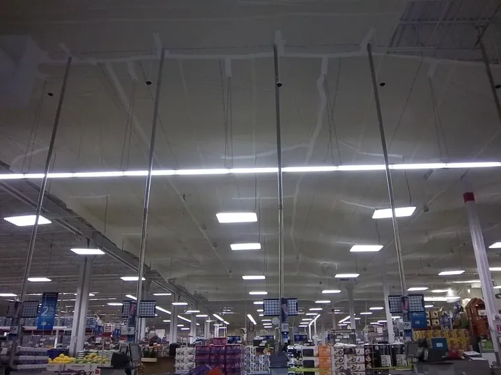 A grocery store with temporary suspended ceiling covers