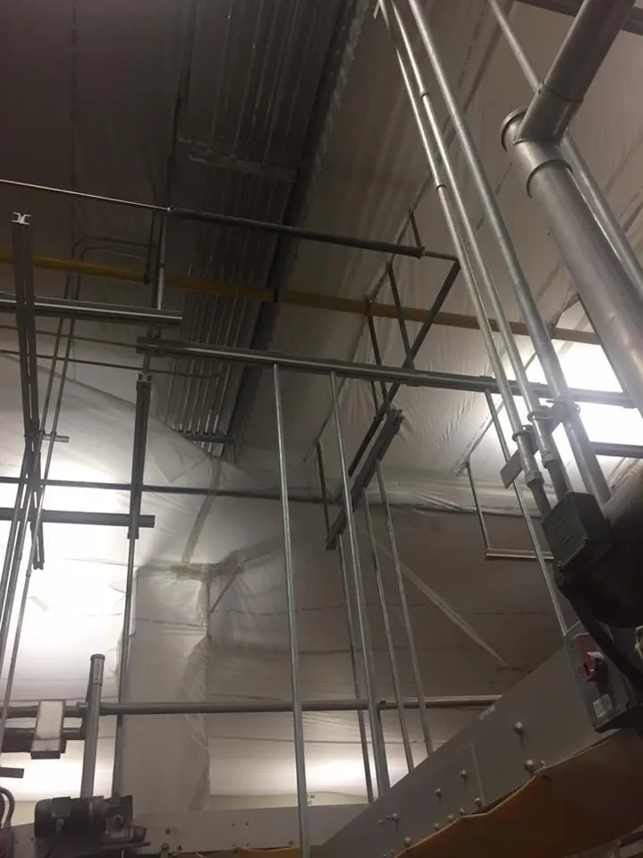 A facility with temporary suspended ceiling covers